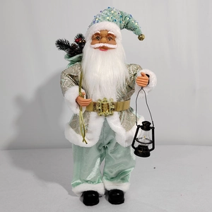 Detail of mint green Santa figurine with gold glasses holding a vintage black lantern