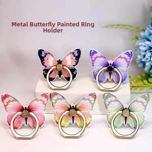 Detail view of five colorful butterfly phone ring holders with metallic gold finish