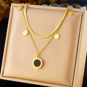 Double-layered gold stainless steel necklace with round Roman numeral and disk pendants
