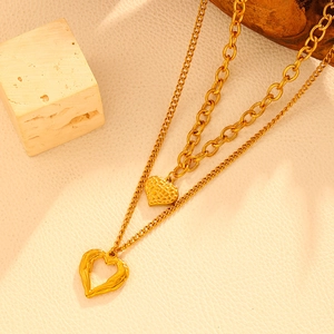 Double-layered 18k gold stainless steel necklace with solid and hollow heart pendants