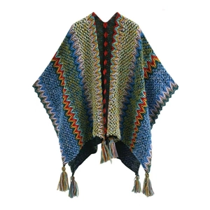 Close-up of vibrant knitted shawl featuring a detailed wave pattern and colorful tassels