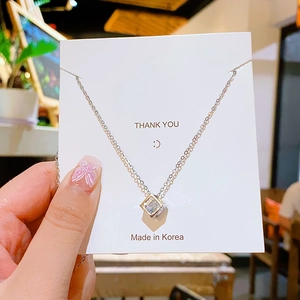 Minimalist silver titanium steel necklace with a hollow cube zircon pendant for women