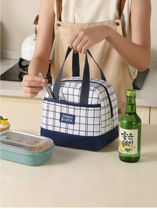 Detail of insulated lunch bag with navy grid pattern and sturdy carrying handles