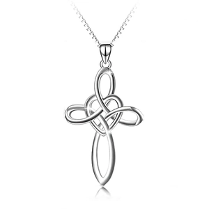 Detailed macro view of silver Celtic knot cross heart pendant with high-polish finish