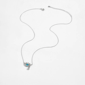 Close-up of S925 silver Evil Eye necklace with blue stone and water drop gemstone