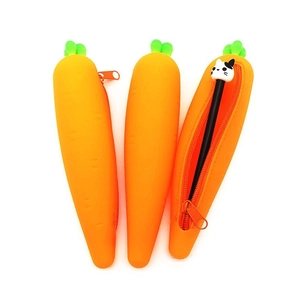Creative carrot shaped silicone pencil case with green leaf detail and cat pen on white background