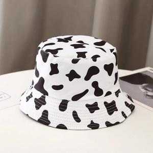 Stylish double-sided cow print bucket hat for men and women in classic black and white