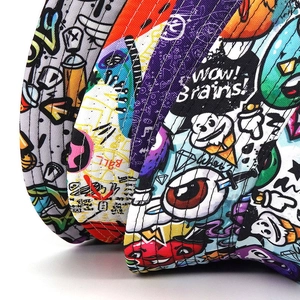 Detailed close-up of vibrant graffiti print and stitching on canvas bucket hats