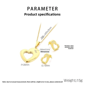 Detail view of gold heart jewelry set with stainless steel necklace and rhinestone earrings