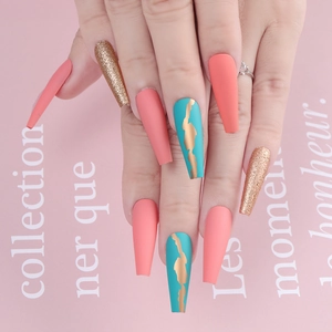 Extra long coffin press-on nails with coral pink matte, orange glitter and gold line art