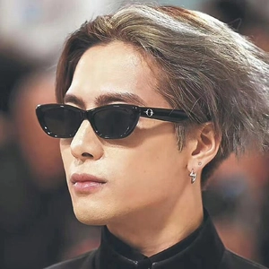 Fashionable retro cat-eye sunglasses with small black frames and silver lightning earrings