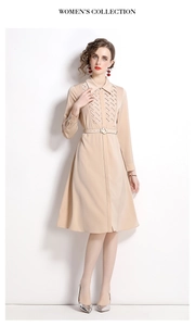 Detail of apricot long-sleeve dress featuring a lapel collar and woven texture with belt