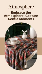 Detailed view of British plaid tablecloth featuring elegant white tassel edges
