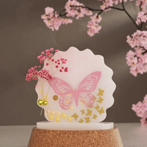 Artistic pink butterfly resin frame with pearl accents and decorative dried flowers