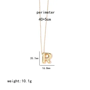 Detailed view of golden letter R pendant with dimensions 20.7mm high and 10.1g weight