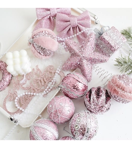 Pink Christmas ball ornaments with glitter star and Merry Christmas sign in a tray