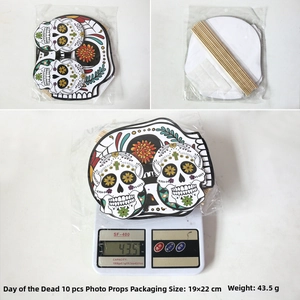Detailed view of 10 Day of the Dead photo props with skull cards and wooden sticks