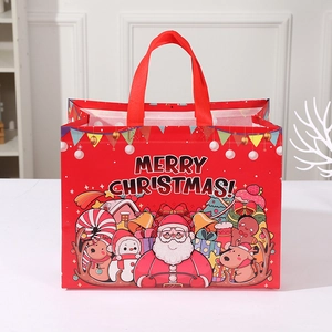 Red Christmas non-woven gift bag with snowman and reindeer prints for holiday treats