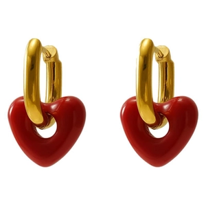 Vintage gold U-shaped hoop earrings with red enamel heart pendants on a white background