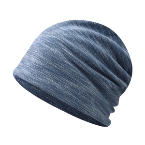 Detailed texture of dark blue slouchy beanie made of breathable marled knit fabric
