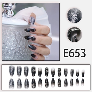Cat-eye stiletto press-on nails with silver marble ink design and glitter finish