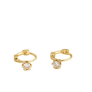 Minimalist gold hoop earrings featuring a single round diamond in a six-prong setting