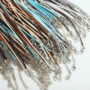 Detailed macro shot of multicolored wax necklace cords with lobster clasps and chains
