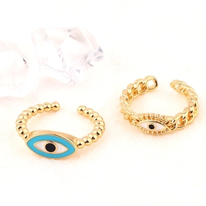 Detailed view of adjustable evil eye rings with blue enamel and crystal accents