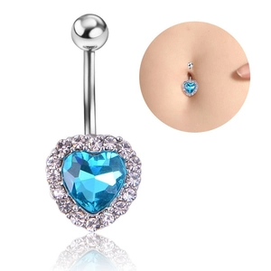 Detail of silver heart navel ring with blue crystal and model wearing demonstration