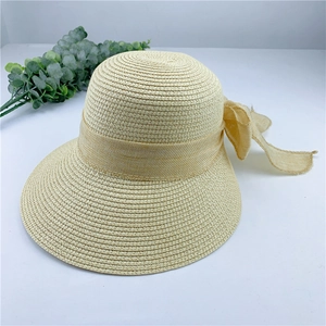 Chapeau de soleil en paille beige de style français avec grand nœud pour la plage