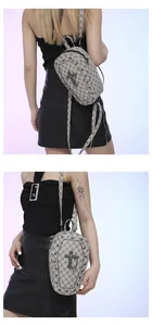 Gothic coffin-shaped mini bag detail featuring black cross emblem and metallic rivets