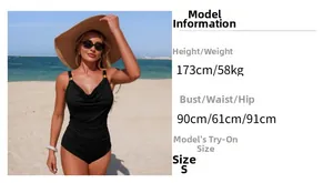 Detail view of black one-piece swimsuit with ruched waist and gold shoulder hardware