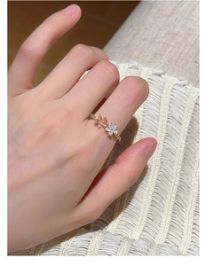 Detailed view of s925 silver ring featuring two elegant pearl flower petals in gold finish