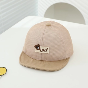 Detail of baby mesh sun hat featuring bear embroidery and breathable fabric