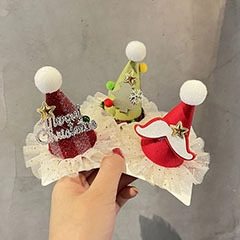 Detailed view of handmade Christmas plush hair clips with Merry Christmas glitter text