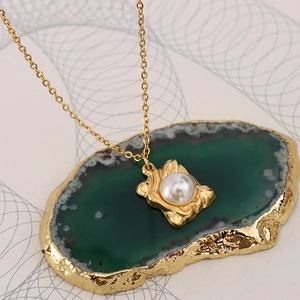 French chic gold chain necklace featuring an irregular pearl pendant on green agate