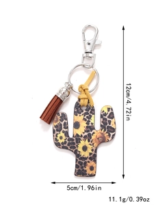 Detail view of cactus keychain with leopard sunflower print, brown tassel and silver ring