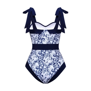 Detail of floral one-piece swimsuit with navy blue shoulder bow ties and high waist
