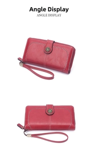 Detail view of burgundy long wallet featuring decorative perforation and white contrast stitching