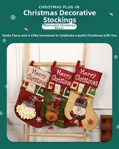 Close-up of burlap Christmas stockings set with Santa reindeer and snowman embroidery