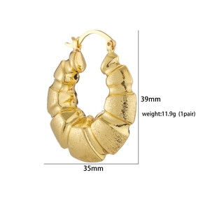 Close-up of gold bamboo texture hoop earrings with size dimensions 39mm by 35mm