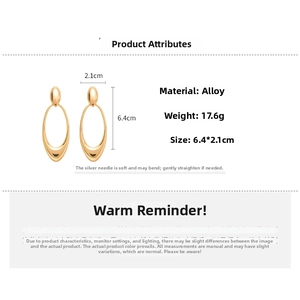 Detailed size chart of gold hollow oval earrings with dimensions 6.4cm by 2.1cm
