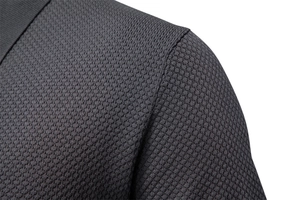 Macro detail of dark grey knit texture and shoulder seam on a men's polo shirt