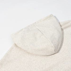 Front view of an oatmeal hooded sweatshirt featuring heavy knit fabric and double-layered hood
