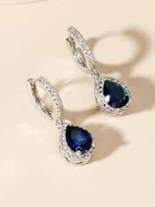 Elegant silver waterdrop earrings featuring deep blue crystals and shimmering accents