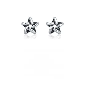 Detail shot of 925 sterling silver hollow star earrings with sleek polished finish