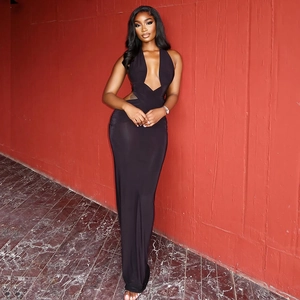 Detail of black halter maxi dress showing deep V-neckline and waist cutout design
