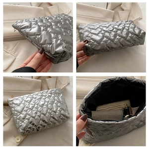 Detailed views of silver quilted heart pouch showing texture and internal storage