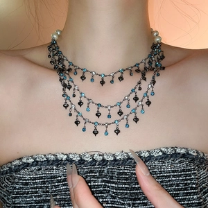 Three-layer gothic fringe necklace featuring black heart pendants and blue zircons
