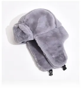 Detail showing plush grey aviator hat with faux fur lining and plastic buckle fastener